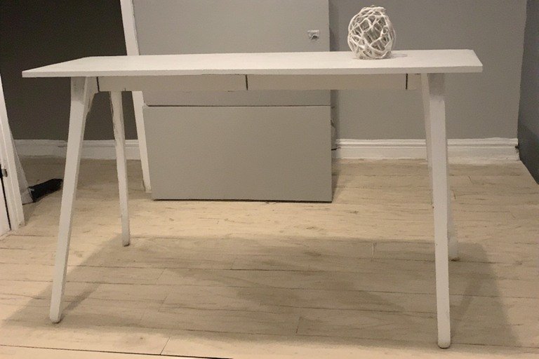 Minimalist desk with one accent piece plant or art