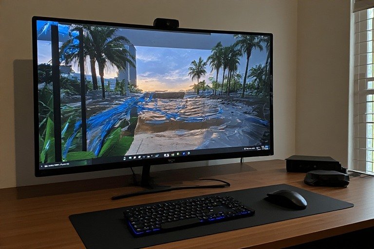Under-desk cable management tray with bundled power cords and velcro straps